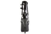 Bottines de clubbing haut de gamme noir laqué pour shows drag et performances fetish de luxe. Bottines de clubbing haut de gamme noir laqué pour shows drag et performances fetish de luxe.